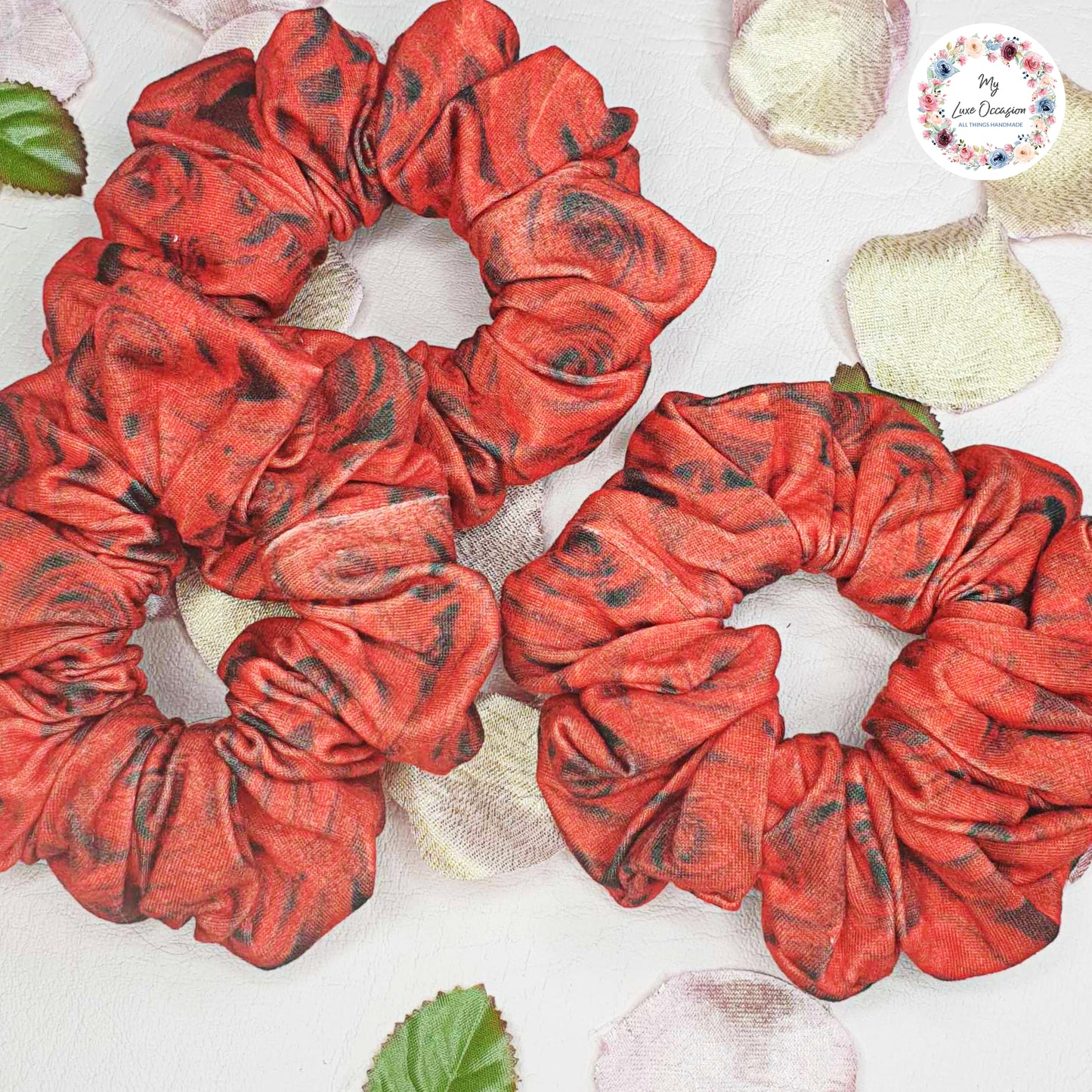 Add a touch of boldness to your hair with our Red and Black Roses Scrunchie! Handmade by myluxeoccasion, this scrunchie guarantees no wilted flowers.