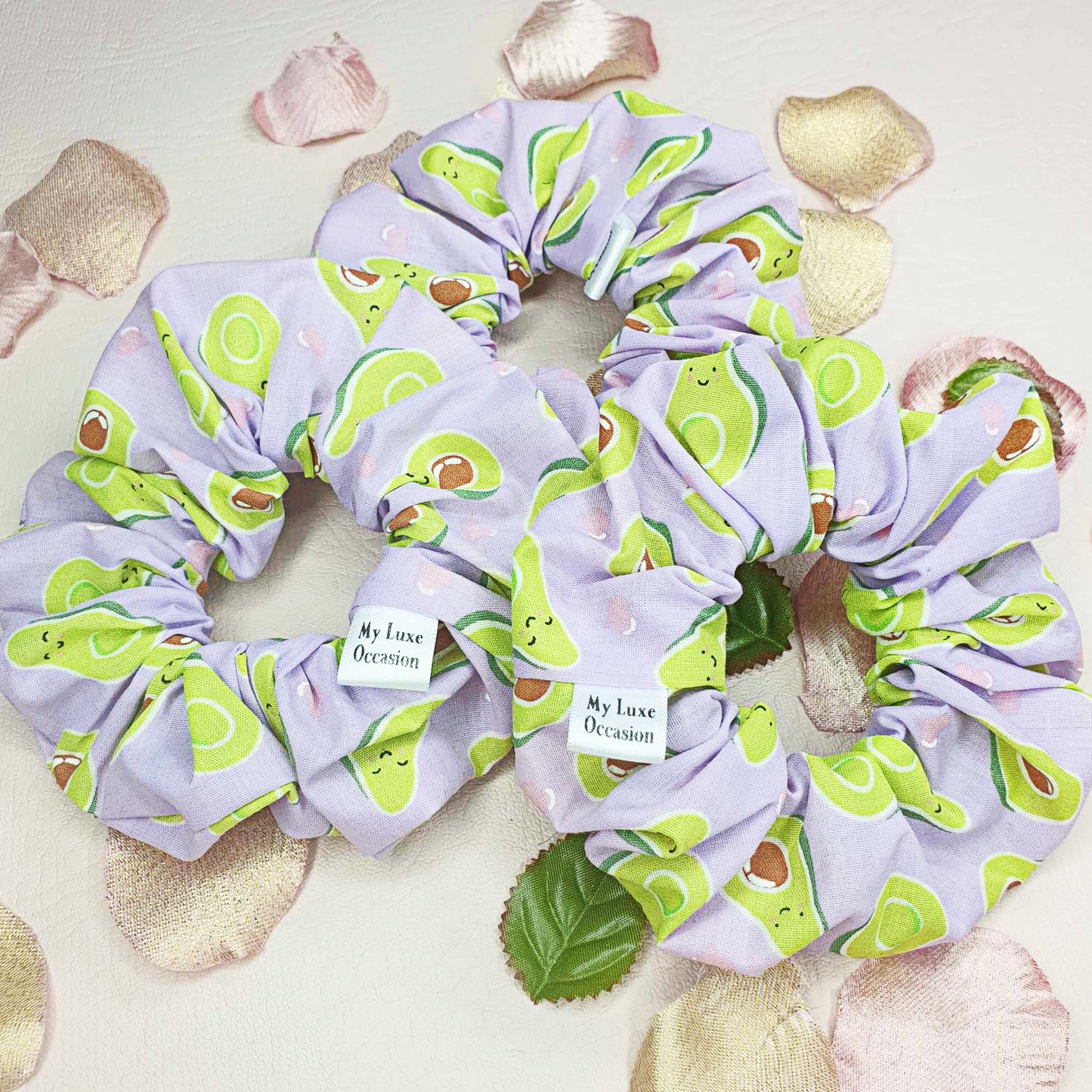 Introducing the Purple Avocado Scrunchie - the perfect blend of cuteness and handcrafted luxury! Made by myluxeoccasion, each scrunchie is unique and adds a touch of fun to any outfit. 