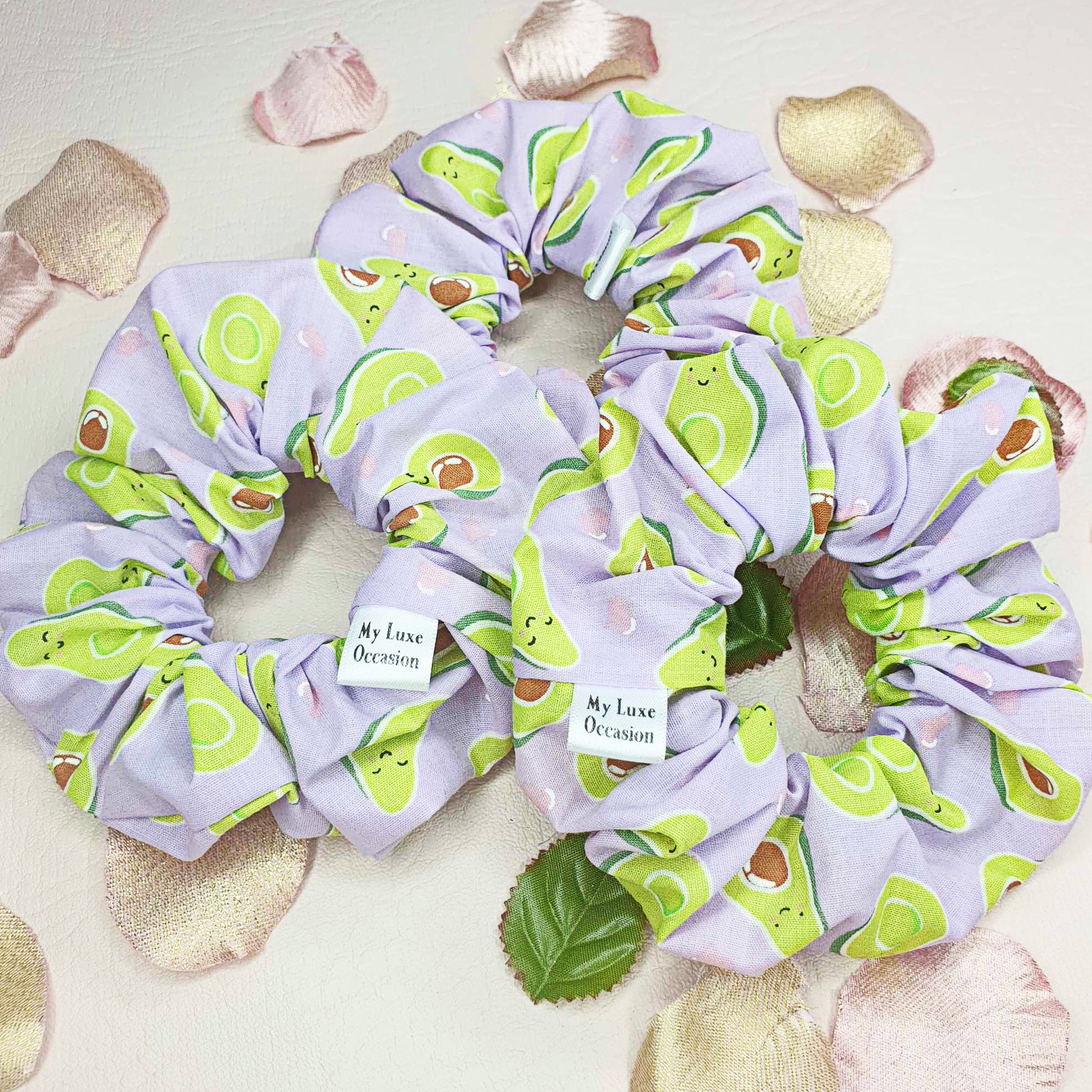 Introducing the Purple Avocado Scrunchie - the perfect blend of cuteness and handcrafted luxury! Made by myluxeoccasion, each scrunchie is unique and adds a touch of fun to any outfit. 