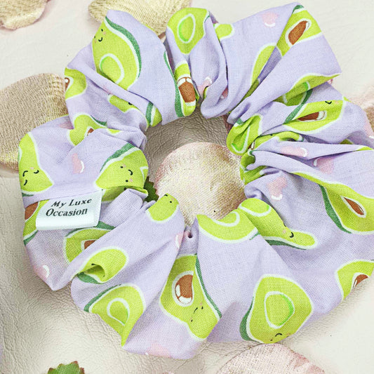 Introducing the Purple Avocado Scrunchie - the perfect blend of cuteness and handcrafted luxury! Made by myluxeoccasion, each scrunchie is unique and adds a touch of fun to any outfit. 